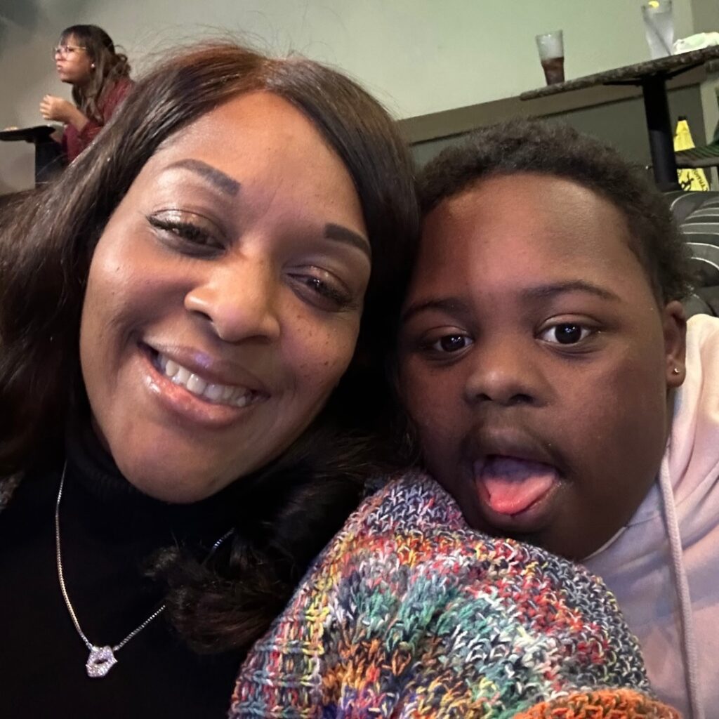 Sheriese Coy-Armour and her son Bryan pose for a selfie photo.