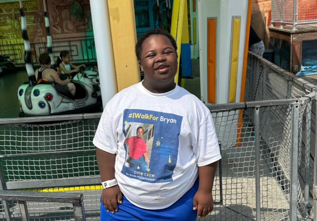 Bryan poses for a photo outdoors.