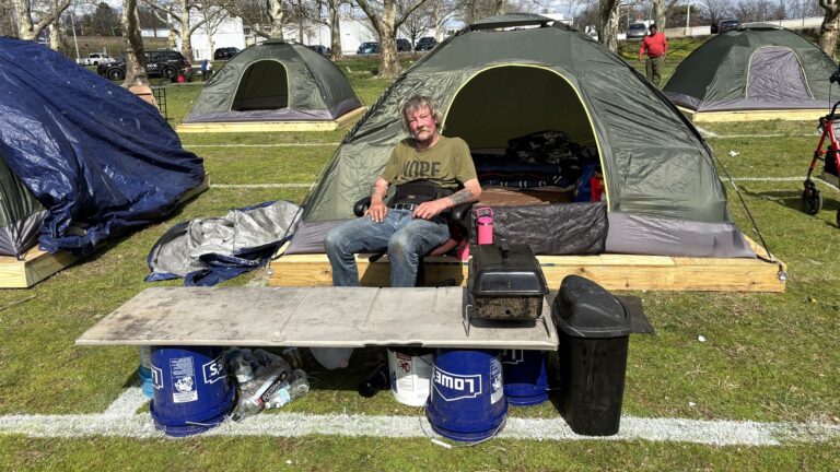 Jerry Alford looks on at a Wilmington homeless encampment