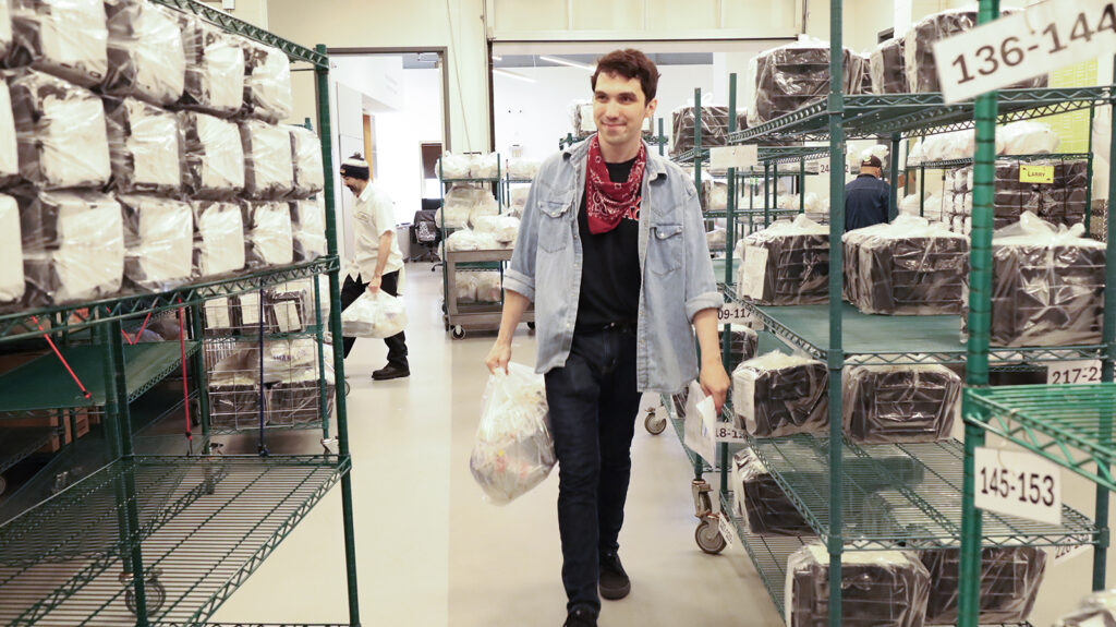 Jamie Pizziketti, volunteer logistics coordinator at MANNA, helps organize medically tailored meals
