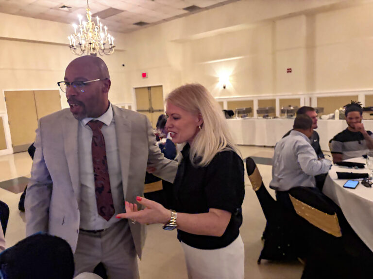 Nicole Poore speaking with Quincy Allen during the luncheon.