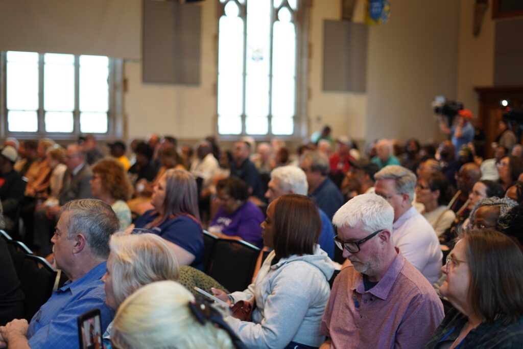 crozer-closure-town-hall-KC-04-041526 A crowd of people listen to a town hall about the future of Crozer-Chester Medical Center, at Widener University, on April 15, 2026