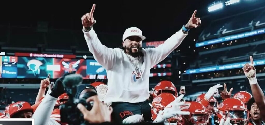 DeSean Jackson being carried on the shoulders of his players with his arms raised