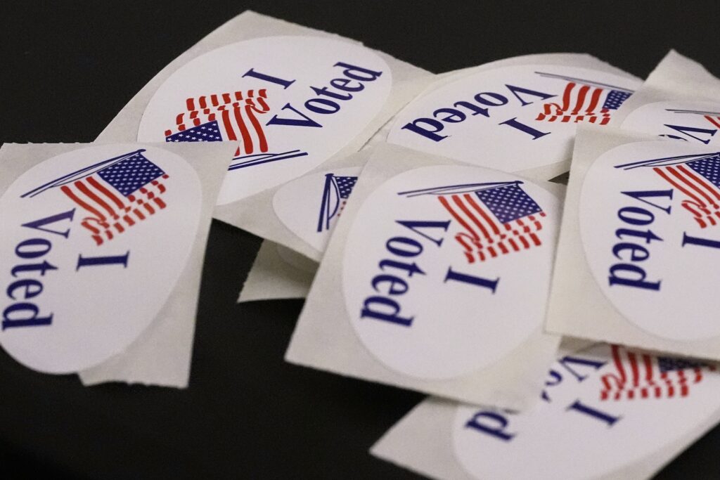 Election 2025 Boston Mayor ''I Voted'' stickers rest on a ballot box at a polling place.