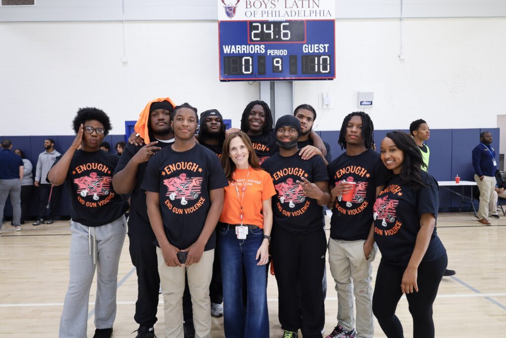n-leonard-2026-04-14-Boys Latin 9 Sophia Collins posing on the basketball court with students.