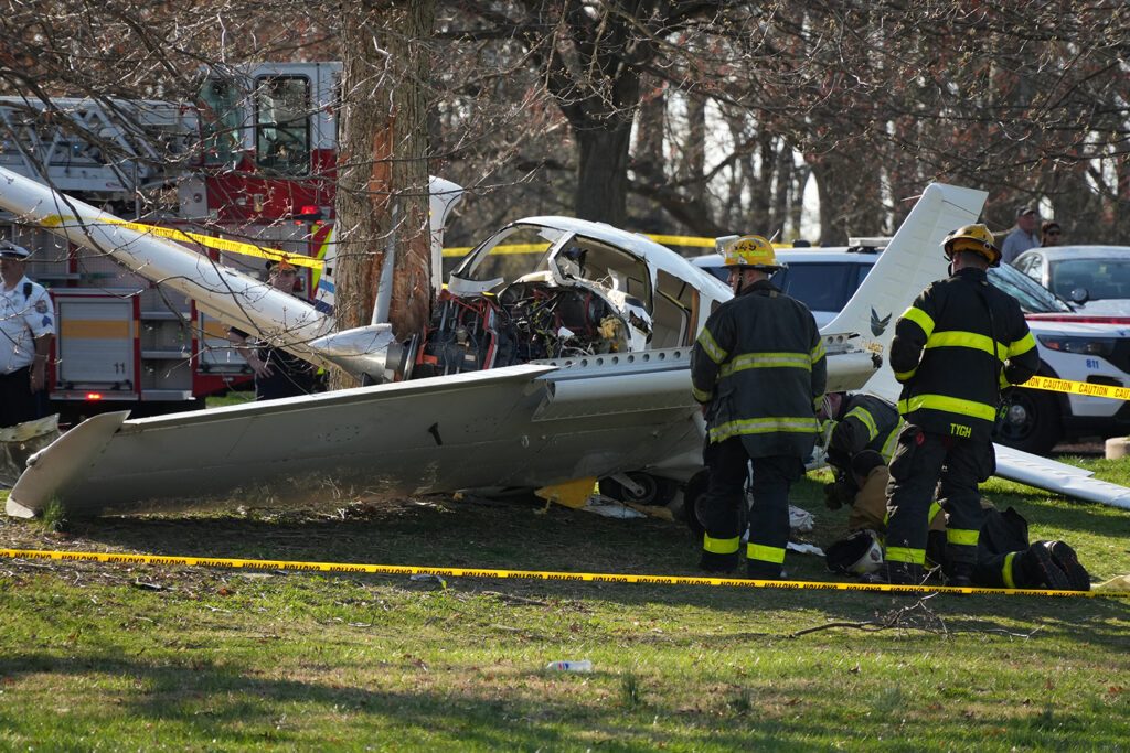 Firefighters respond to the scene after a small airplane made a crash landing