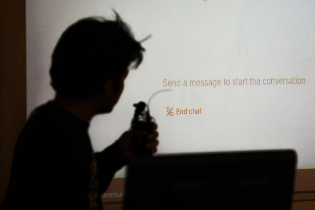 Education Oral Exams Student Surya Newa is silhouetted while using an oral AI agent