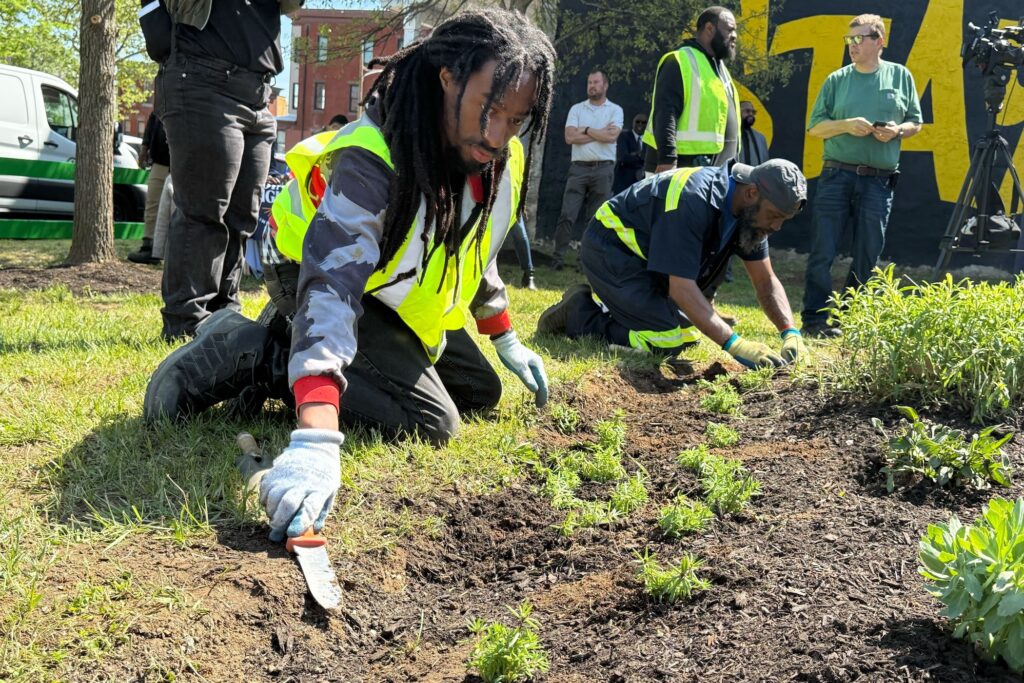 philly-lotscapes-z-read-2026-04-23-4 Workers are planting in the vacant lot.