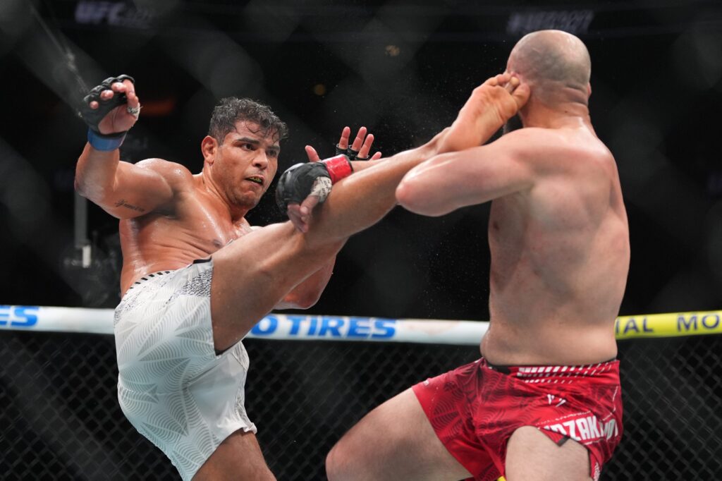 ufc-fight-mma-bp-041426 Paulo Costa, left, of Brazil, fights Azamat Murzakanov, of Russia