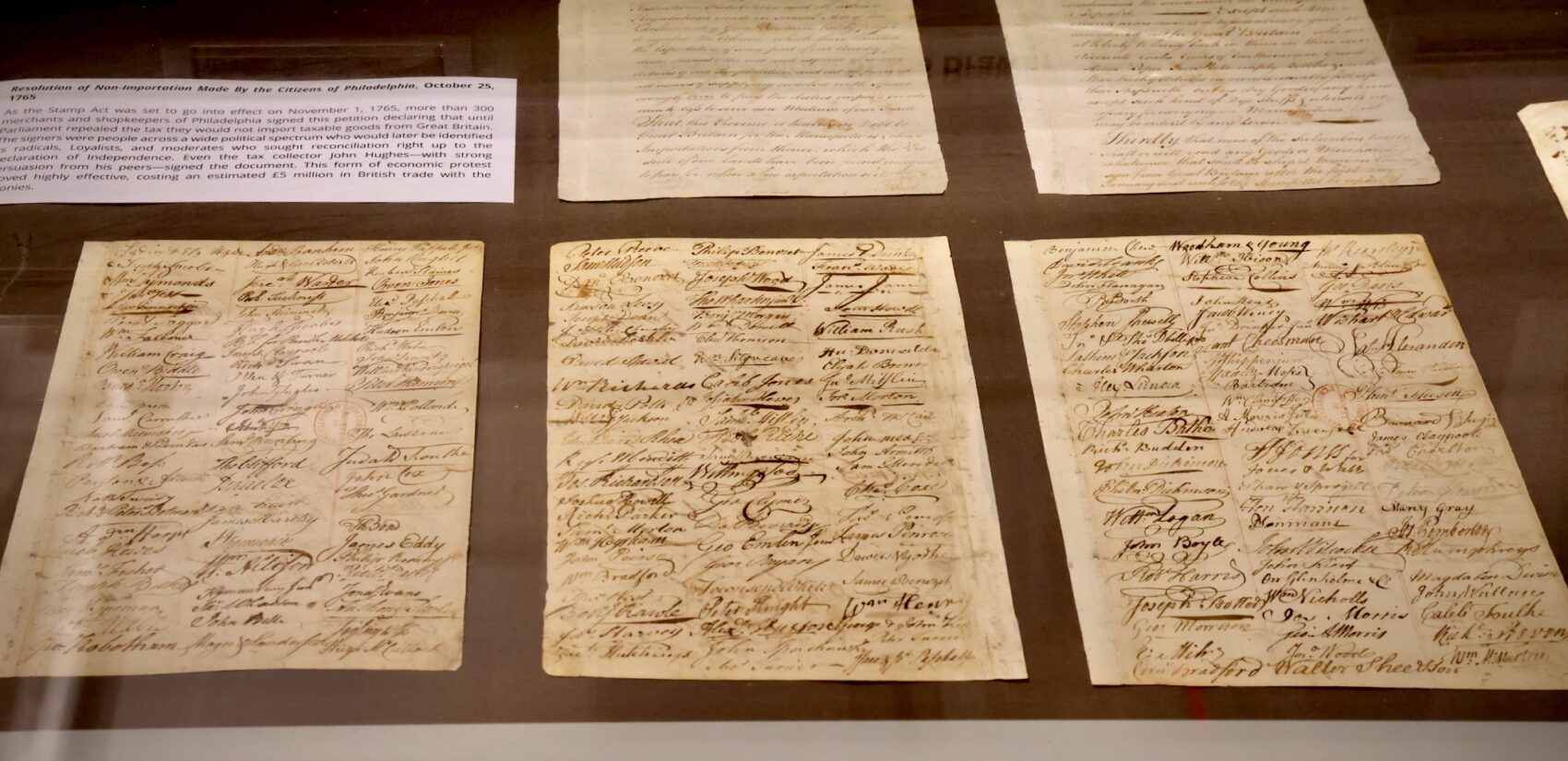 In reaction to the Stamp Act of 1765, more than 300 merchants and shopkeepers of Philadelphia signed this petition declaring that they would not import taxable goods from Great Britain until the act was repealed. (Emma Lee/WHYY)