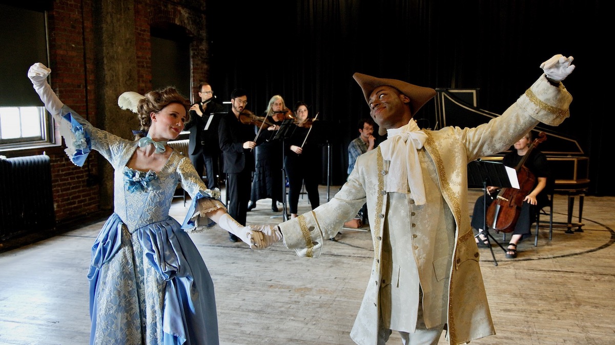 Julia Bengtsson and Patrick Pride pose for photo while demonstrating their performance