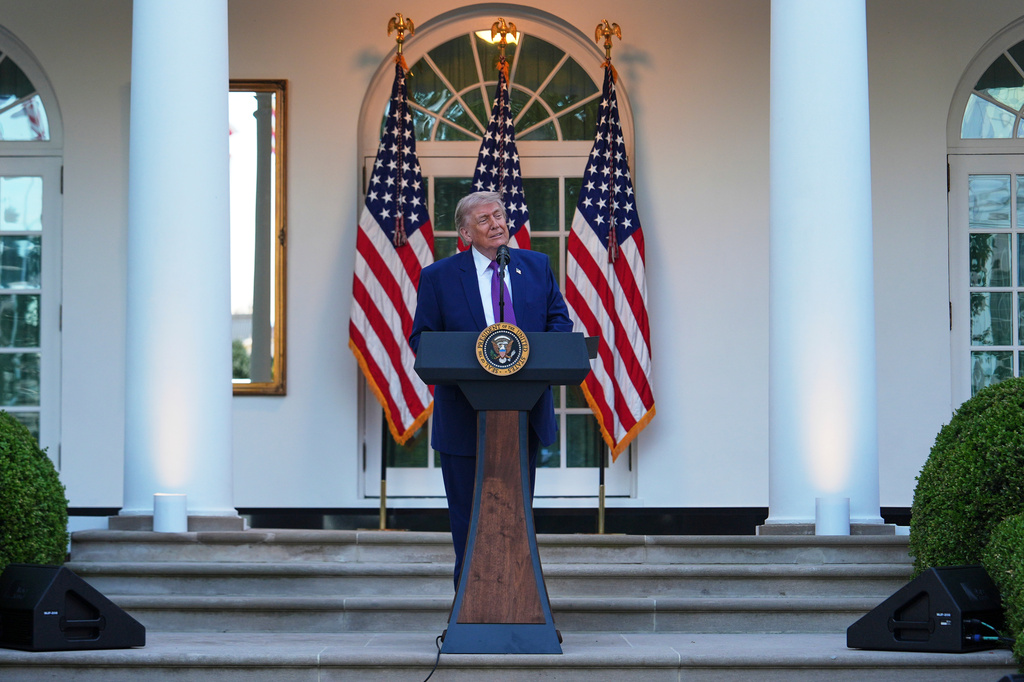 Trump President Donald Trump speaks at a dinner for members of his administration and law enforcement organization leaders, during National Police Week, in the White House Rose Garden, Monday, May 11, 2026, in Washington. (AP Photo/Julia Demaree Nikhinson)