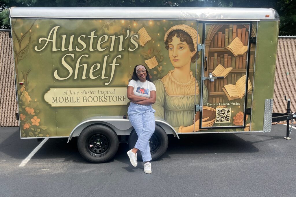 austens-shelf Charity Herndon smiles in front of the Austen's Shelf book trailer