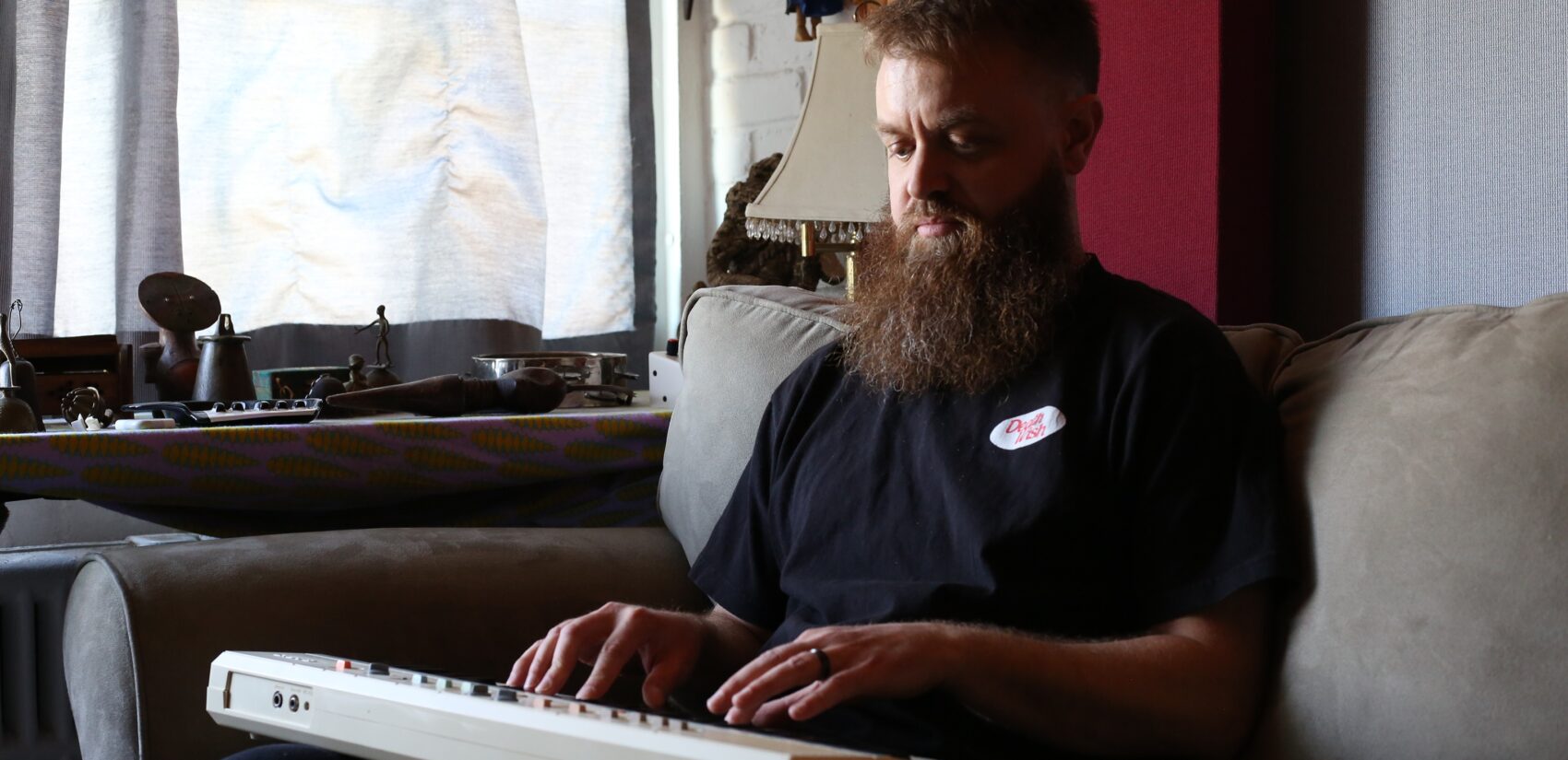 Corey Bernhard playing a keyboard
