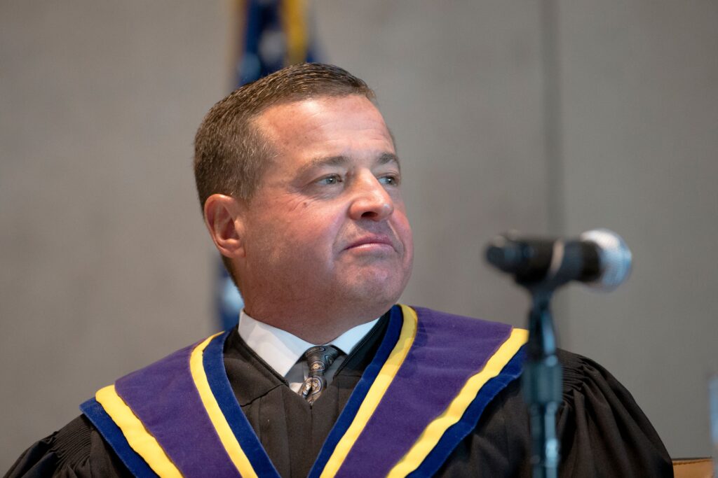 David N. Wecht looks on