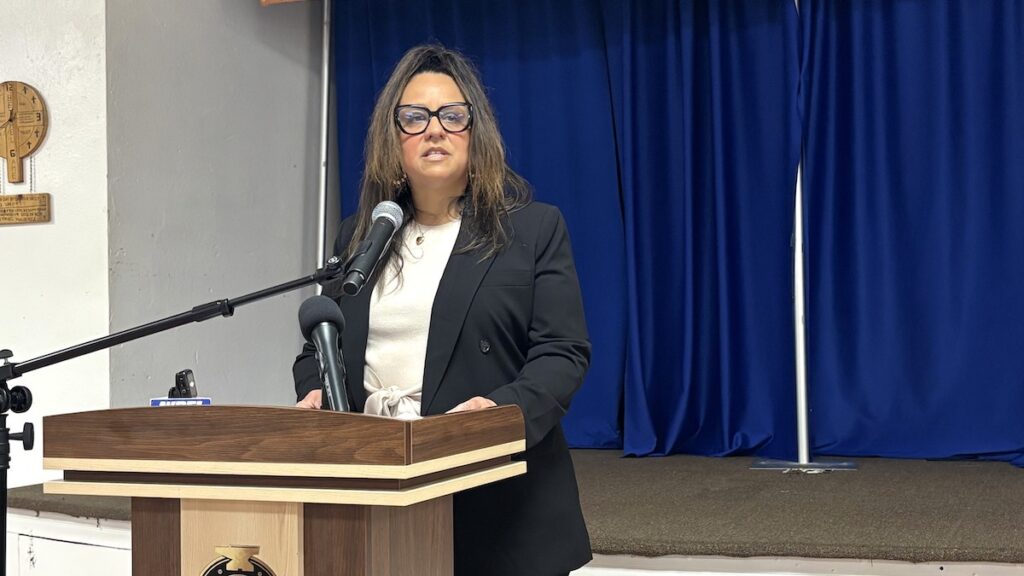 Karen Eller speaking at meeting