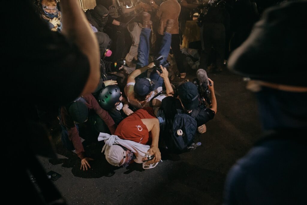Immigration Protests New Jersey Protesters and media are thrown on the road by ICE agents outside the Delaney Hall detention during a protest on Wednesday, May 27, 2026, in Newark, N.J. Inside the facility, detainees carried out a labor and hunger strike for days over alleged living conditions.