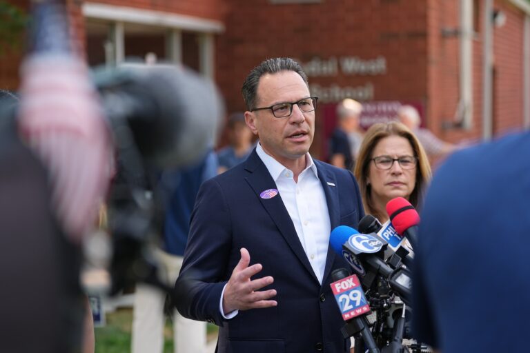 Pennsylvania Gov. Josh Shapiro, accompanied by his wife Lori Shapiro, speaks with members of the media outside his polling place in Rydal, Pa., Tuesday, May 19, 2026.
