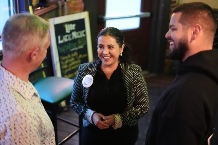 Carol Obando-Derstine, a candidate for the Democratic nomination in Pennsylvania's 7th Congressional District, speaks speaks with attendees at a social event in Bethlehem, Pa., Monday, May 11, 2026.