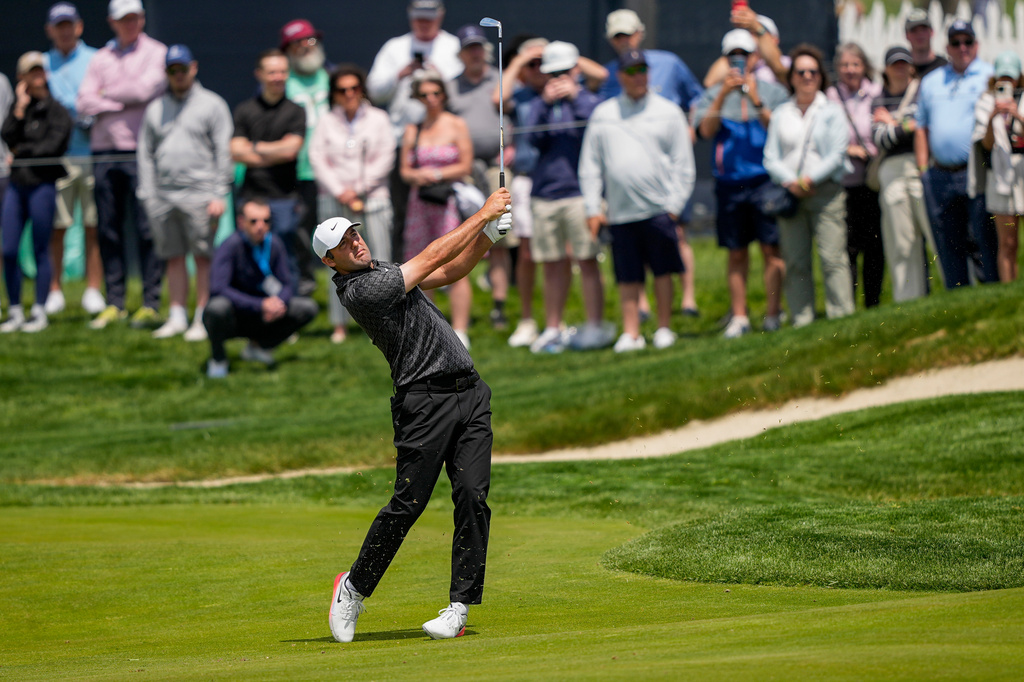Scottie Scheffler hits from the 11th fairway during a PGA Championship golf tournament practice round