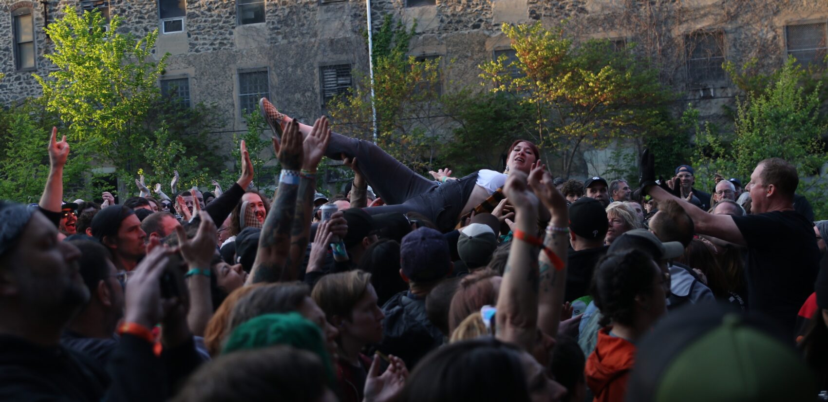 a festivalgoer crowdsurfing