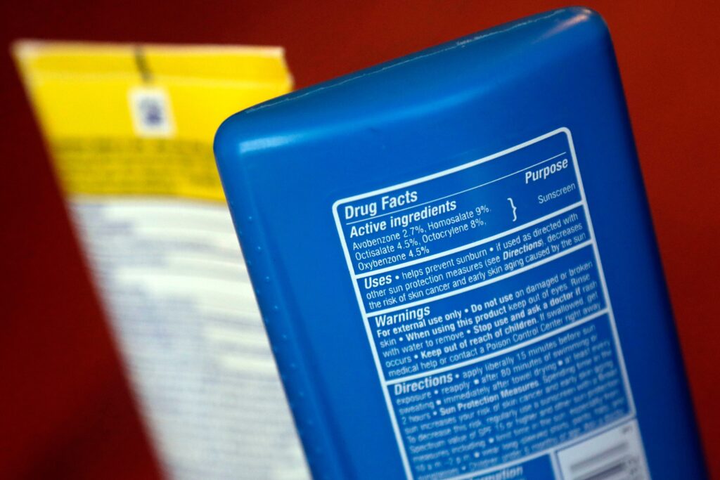 sunscreen-ingredients-file-ap sunscreen ingredients are shown on two bottles