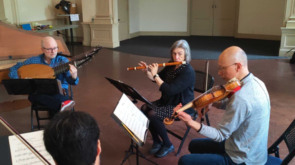 Gwyn Roberts, center, rehearses 