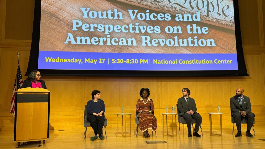 Sarah Glover leading a panel discussion