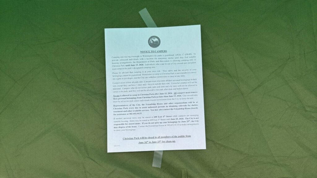 An eviction notice on a tent at a Wilmington homeless encampment