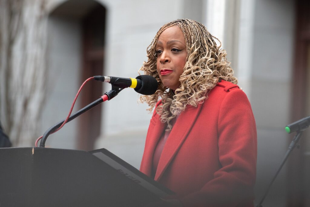 Jamie Gauthier speaking at a podium
