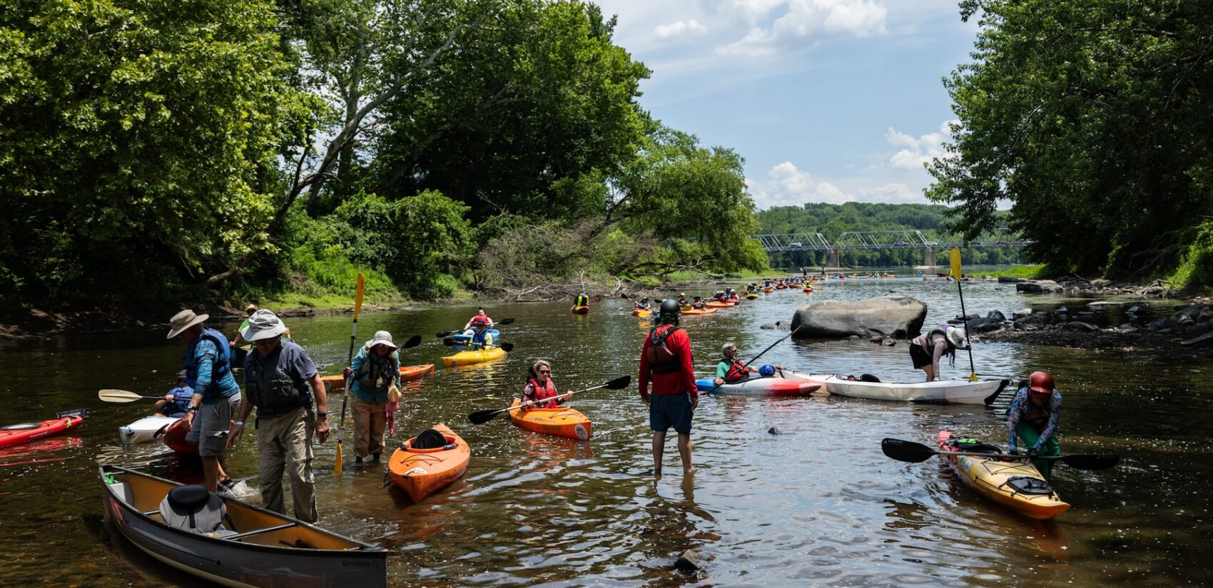People in canoes on the river