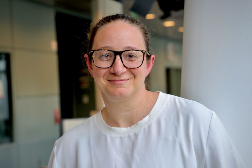 Nicolle Strand is posing for a photo at WHYY studios.