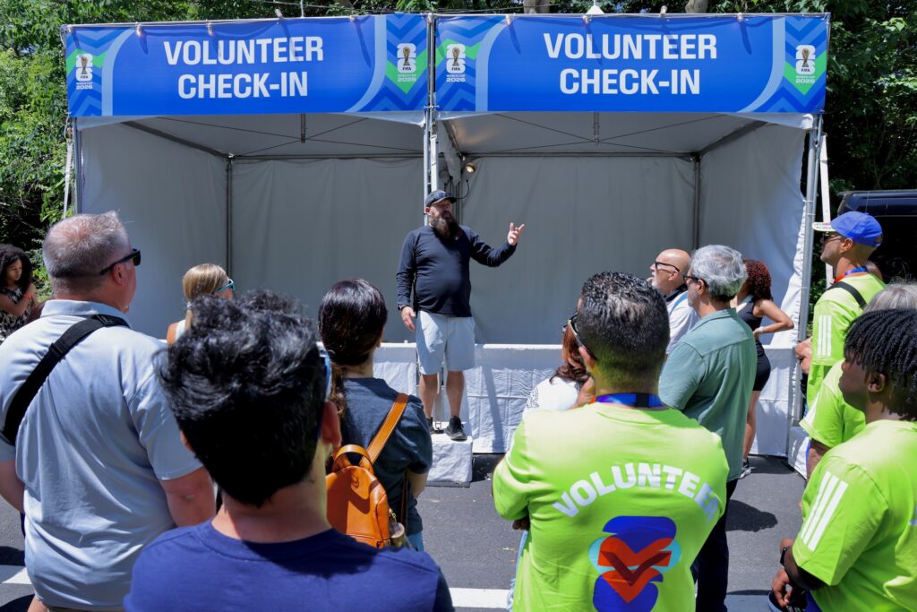 2026 06 08-e lee-brad page-philadelphia lemon hill park-fifa fan festival 2026 volunteer check in Brad Page gives instructions to FIFA Fan Festival volunteers