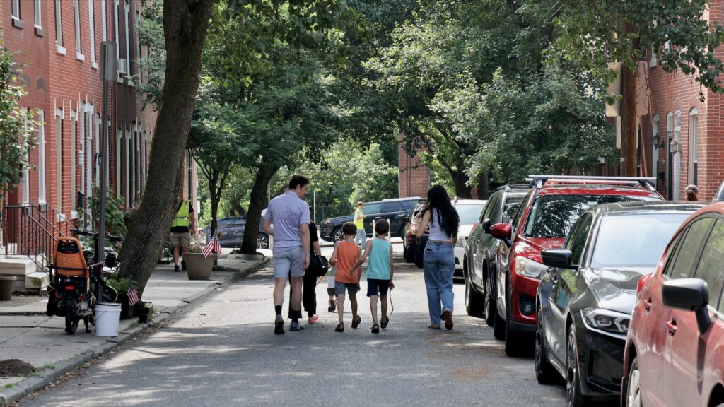 2026 06 10-e lee-philadelphia fairmount-fifa fan fest community preview family A family walks down the street.