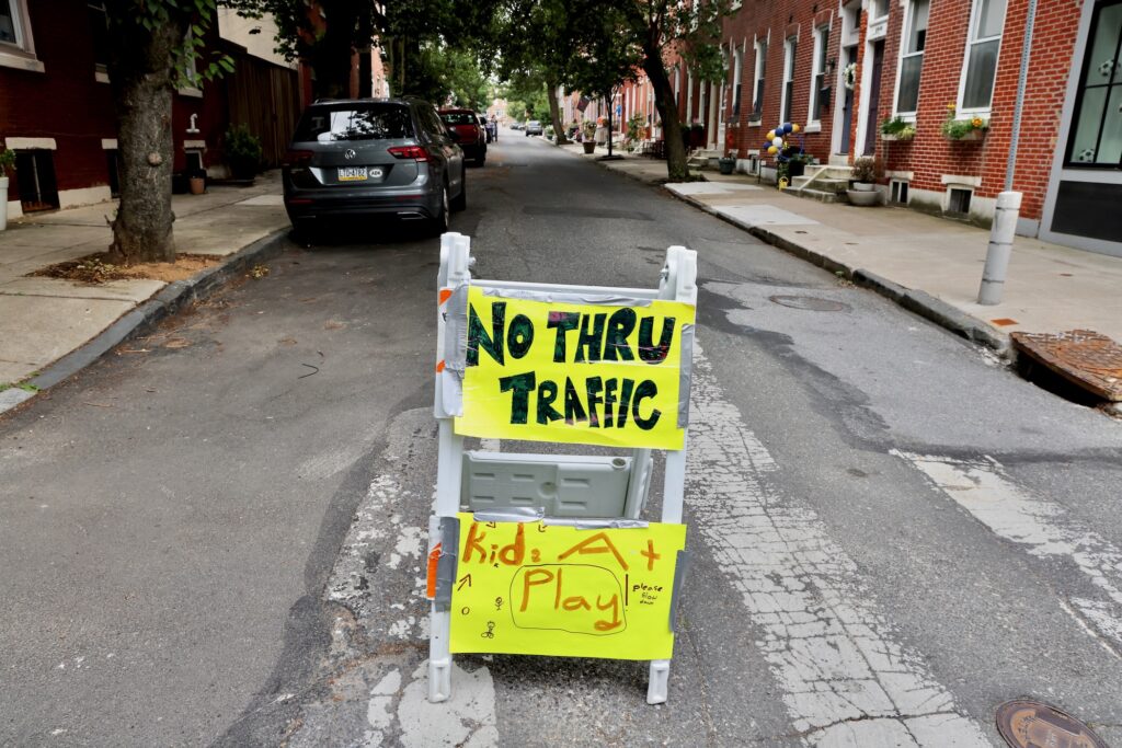 Homemade traffic signs hanging up on the street.