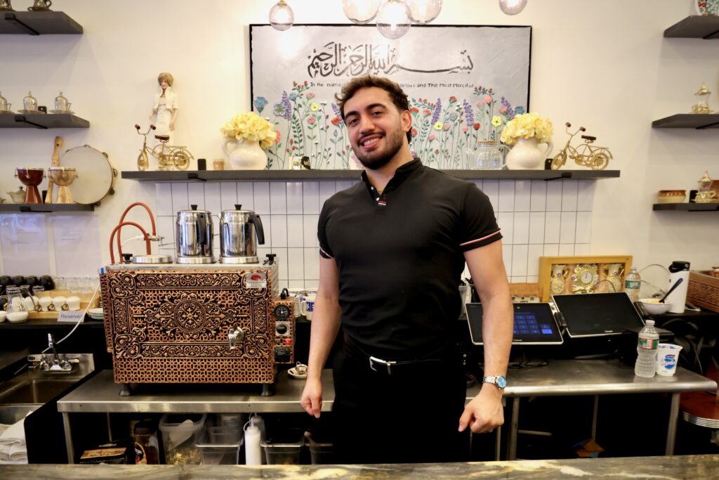 2026 06 11-e lee-muhammed emanet-collingswood nj jersey kebab-deportation fears Muhammed Emanet stands behind the counter at his family's restaurant, Jersey Kebab