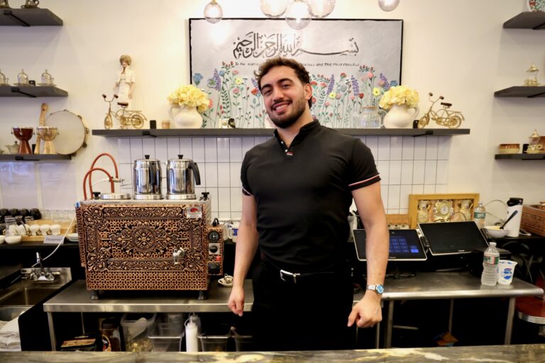Muhammed Emanet stands behind the counter at his family's restaurant, Jersey Kebab