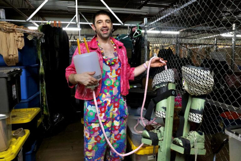 Rose Jarboe of the Bearded Ladies Cabaret holds a giant plug