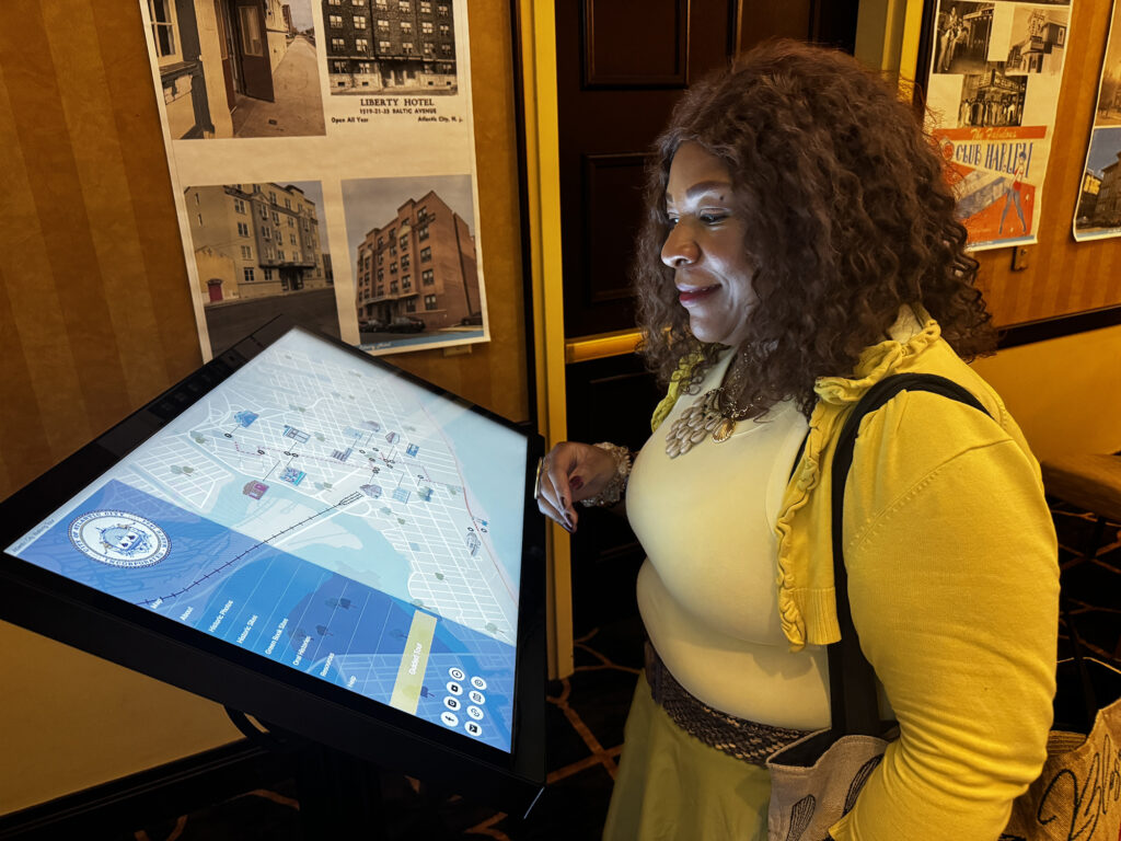 Dolly L. Marshall, historic preservation specialist with the city of Camden and member of the New Jersey Black Heritage Trail Advisory Committee, examines the Atlantic City Black Cultural Heritage Virtual Tour touchscreen installation