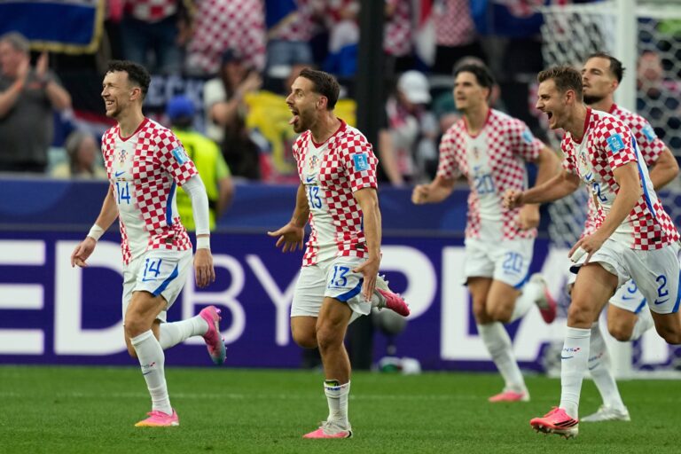 Croatia's Nikola Vlasic (13) celebrates with teammates after scoring his side's second goal
