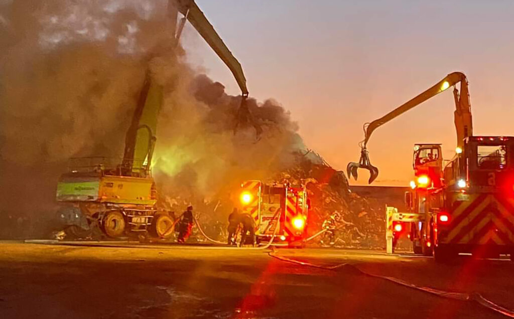 Firefighters working at the scene of a fire.