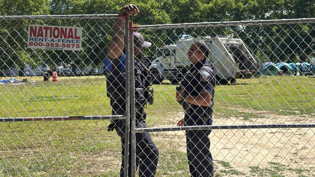 Police-Christina-s-mueller-2026-06-15 Two police officers stand by a fence