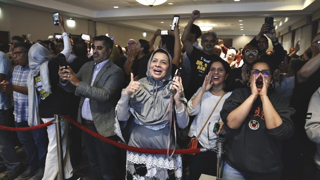 Supporters of Adam Hamawy celebrate his victory