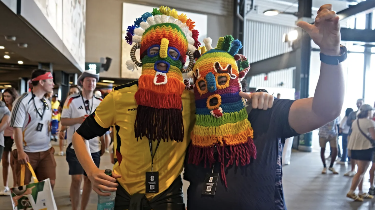 Ethan Warner-Ruf and Marco Flores show off their traditional Ecuadorian masks at a Philadelphia World Cup 2026 match.