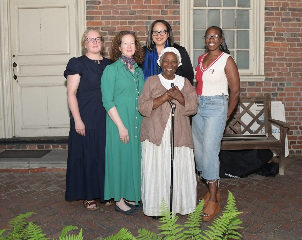 freedom-free-2026-06-10-Dinah Panel 5 Five women pose for a photo together outside of the historic house.