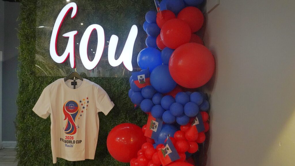 Ballons and a tshirt hang underneath the Gou sign in the restaurant to celebrate Haiti in the World Cup.