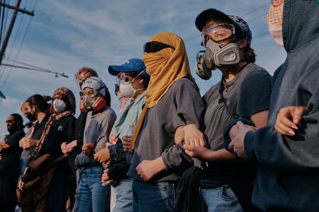 Protesters confront ICE agents outside the Delaney Hall detention center while demonstrating near the entrance gates, Wednesday, May 27, 2026, in Newark, N.J.