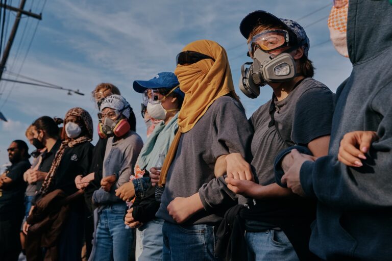 Protesters confront ICE agents outside the Delaney Hall detention center while demonstrating near the entrance gates, Wednesday, May 27, 2026, in Newark, N.J.