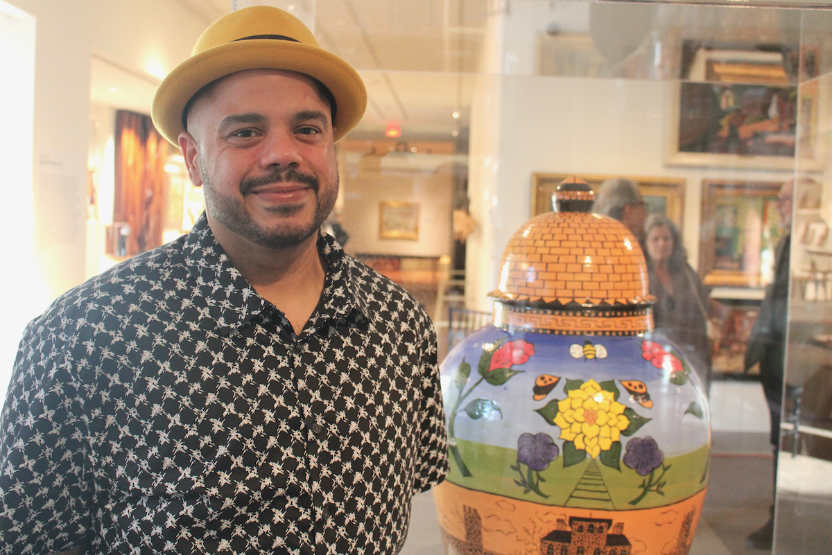 Roberto Lugo posing for a photo in the museum.