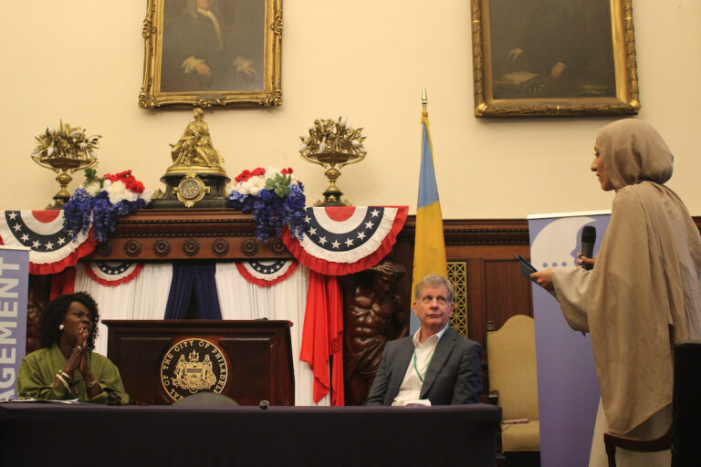 A student, right, asks Mayor Cherelle Parker, left, a question